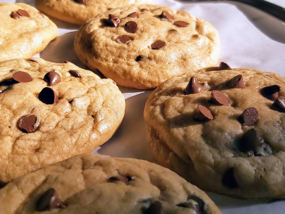 A batch of chocolate chip cookies close up.