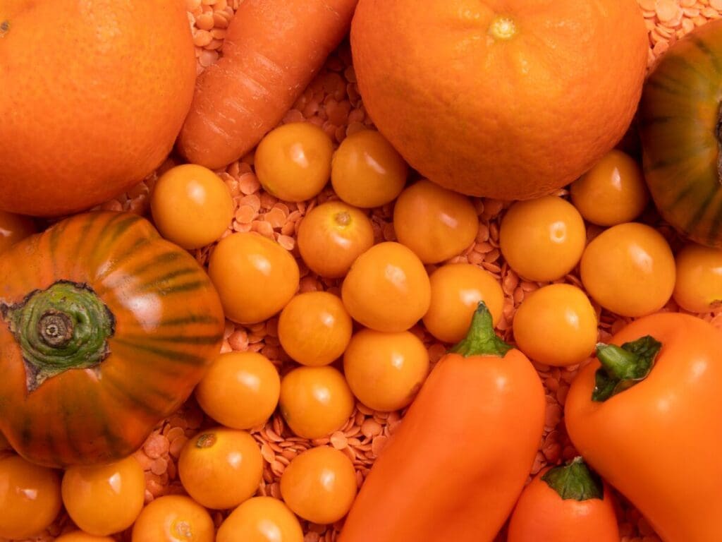 A variety of orange fruits and vegetables